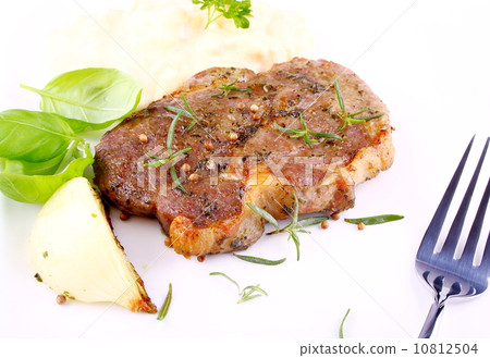 Herb Grilled steak meat with onion, basil and potato Herb Grilled steak meat with onion, basil and potato 10812504