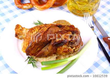 Grilled pork with pickled cabbage,  beer and pretzels 10812539