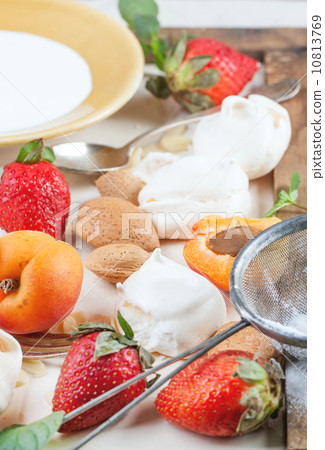 Meringue with apricot and strawberry 10813769