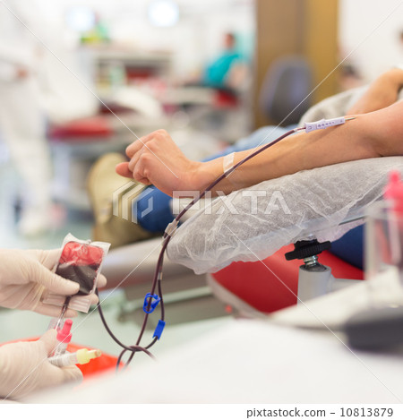 Nurse and blood donor at donation. 10813879