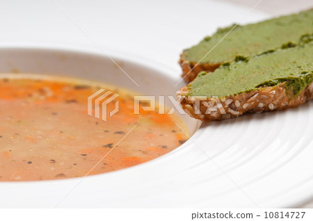 Italian minestrone soup with pesto crostini on side 10814727
