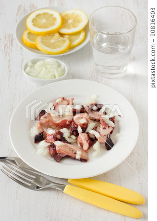salad with octopus on the white plate 10816403