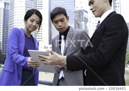Asian working professionals outdoor 10816481