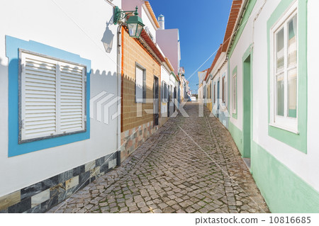 Traditional old Portuguese street with stone lane. Ferragudo. 10816685