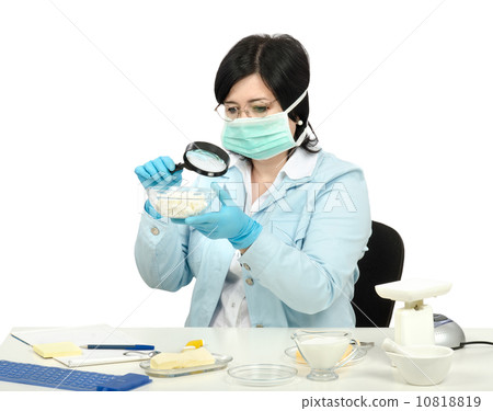 Expert viewing closely a cottage cheese in laboratory 10818819