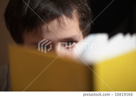Young boy reading a book 10819168