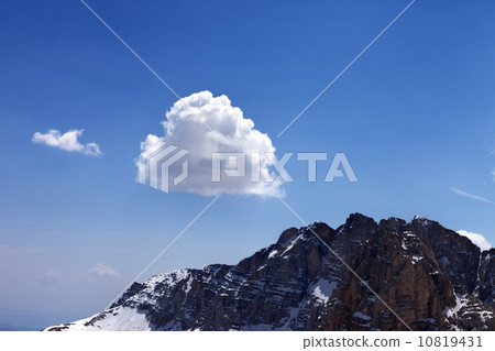 Blue sky with clouds and snow rocks 10819431