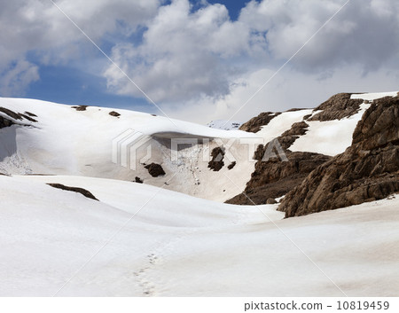 Snowy mountains with cornice 10819459