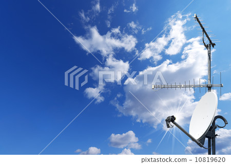 Satellite Dish and Antenna TV on Blue Sky 10819620