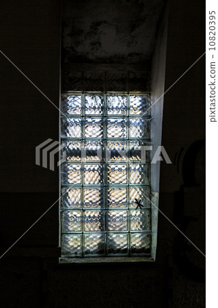 window with glass bricks in a dark room 10820395