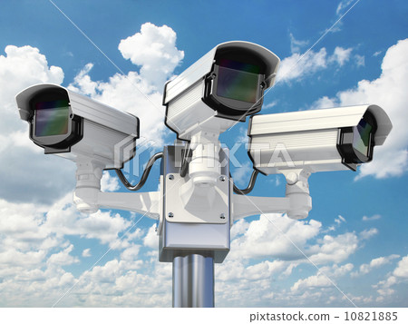 CCTV security camera on cloud sky background. 10821885