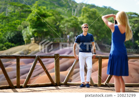 Young couple sightseeing Chamarel coloured earths Young couple sightseeing Chamarel coloured earths 10823299