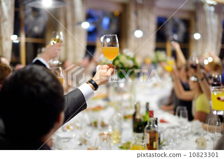 Men's hand holding glass of juice Men's hand holding glass of juice 10823301