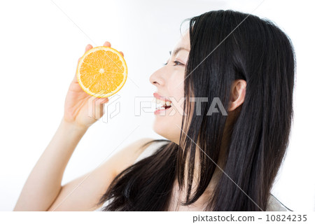 A woman with an orange 10824235