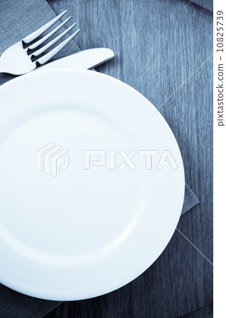 plate, knife and fork at cutting board plate, knife and fork at cutting board 10825739