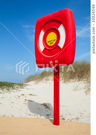 Safety life buoy in red case stand on the beach 10826598
