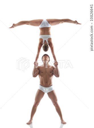 Couple of gymnasts showing stand on hand Couple of gymnasts showing stand on hand 10826641