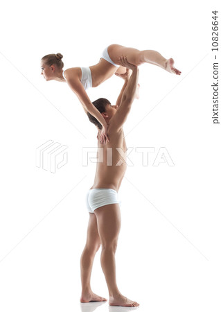 Gym support in performance of two young acrobats Gym support in performance of two young acrobats 10826644