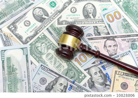 gavel is on the U.S. dollar different denominations 10828806