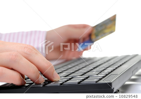 Typing credit card information for online shopping concept, isolated on white background 10829548
