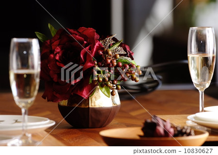 Red flowers and dining table 10830627