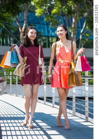 Young asian female shoppers Young asian female shoppers 10831505