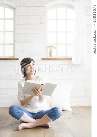 A woman reading a book A woman reading a book 10831673