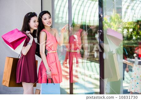 Young asian female shoppers 10831730
