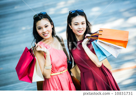 Young asian female shoppers 10831731
