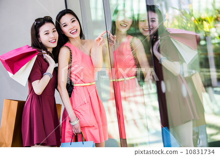 Young asian female shoppers 10831734