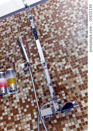 Modern designer tap and shower in bathroom 10835330