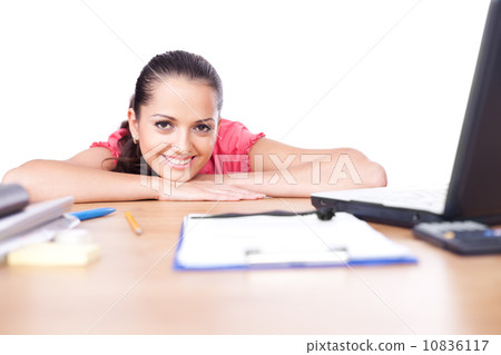 Portrait of relaxed young business woman smiling at office Portrait of relaxed young business woman smiling at office 10836117