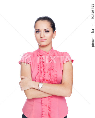 beautiful young businesswoman standing with hands folded against 10836153
