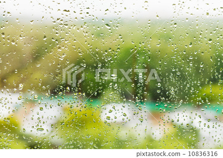 rain drops on window glass in summer day 10836316