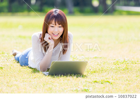 A woman using a computer 10837022