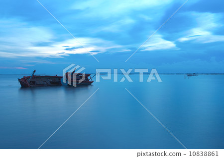 Shipwreck in the ocean on twilight 10838861