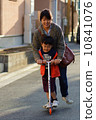 Children and mothers playing with skaters 10841076
