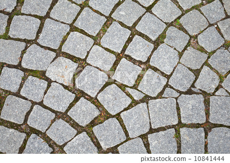 Gray granite cobblestone pavement. Closeup background texture Gray granite cobblestone pavement. Closeup background texture 10841444