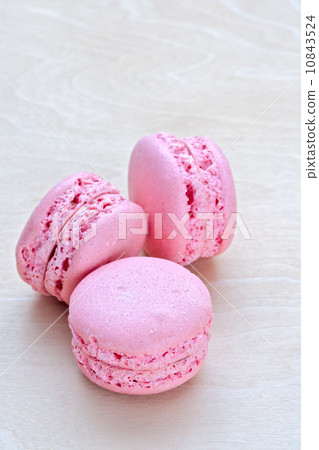 pink macaron on wooden background pink macaron on wooden background 10843524