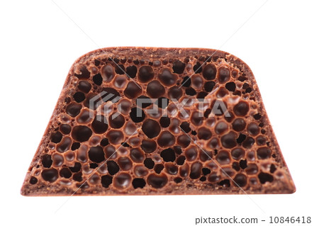 Cut of porous milk chocolate. Cut of porous milk chocolate. 10846418