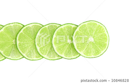 Row lime slices on a white background 10846828