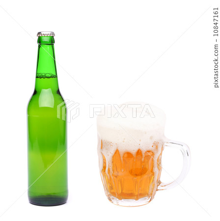 Closed bottle and mug of beer with froth. 10847161
