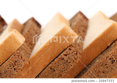 Slices of brown and white bread. 10847353