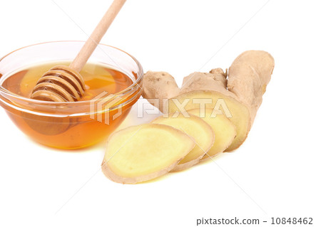 Root Ginger sliced and bow of honey. 10848462