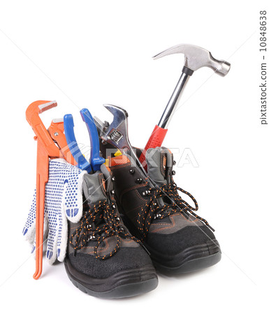 Working tools in boots. Working tools in boots. 10848638