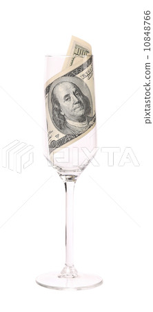 One hundred dollar banknote in the glass. One hundred dollar banknote in the glass. 10848766