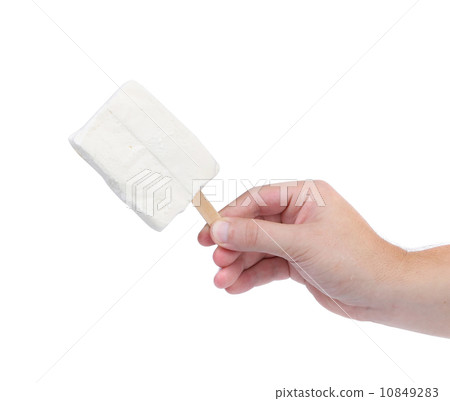 Hand holds white chocolate ice cream. 10849283