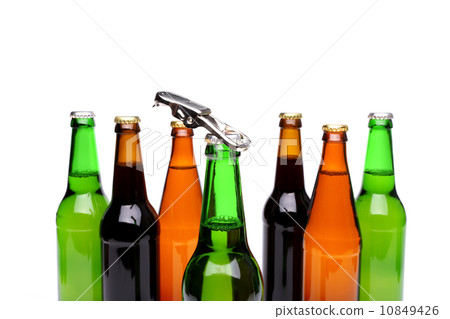 Opener. Bottlenecks. Bottles of beer. Close up. Opener. Bottlenecks. Bottles of beer. Close up. 10849426