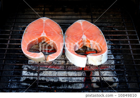 Two fresh salmon steaks on BBQ Two fresh salmon steaks on BBQ 10849810