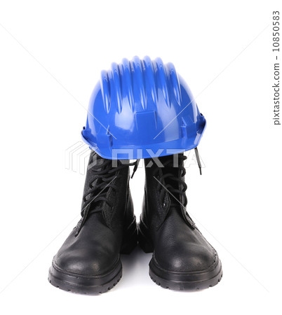 Hard hat and working boots. Hard hat and working boots. 10850583